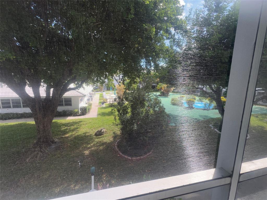 2050 Northeast 39th Street, Unit 209W Lighthouse Point, FL 33064 - Photo 20 of 27 a view of a glass door