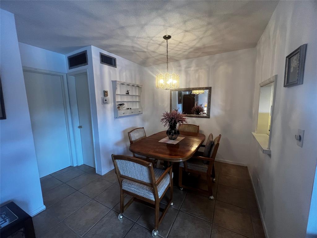 2050 Northeast 39th Street, Unit 209W Lighthouse Point, FL 33064 - Photo 7 of 27 a view of a workspace with furniture