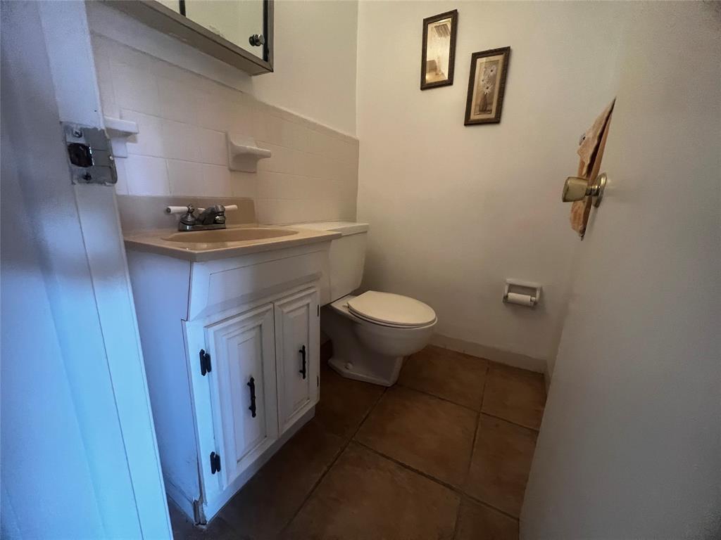 2050 Northeast 39th Street, Unit 209W Lighthouse Point, FL 33064 - Photo 9 of 27 a bathroom with a sink toilet and vanity