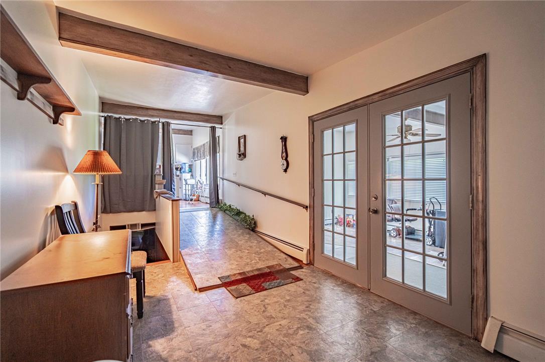 579 Cherry Road Northampton, PA 18067 - Photo 23 of 57 Textured flooring and exposed ceiling beams define this adaptable interior space which segways the sunroom and garage with handicap accessible access to main home.