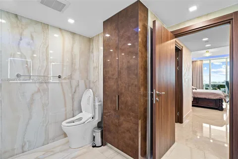a bathroom with a shower and a toilet