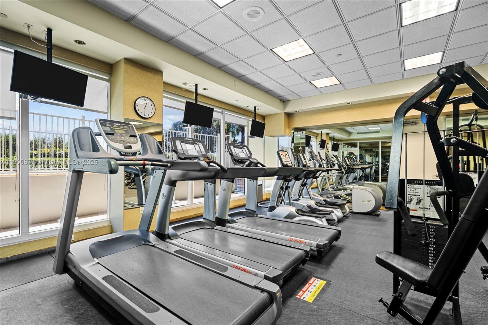9559 Collins Avenue, Unit S8F Surfside, FL 33154 - Photo 25 of 27 a view of a room with gym equipment
