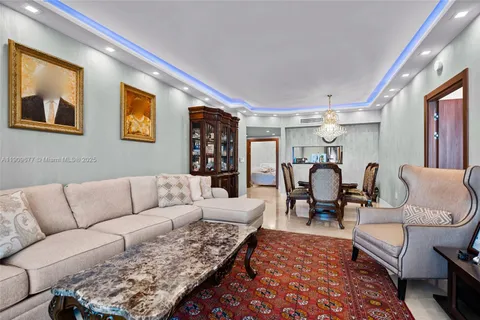 a living room with furniture or couch and a dining table next to a window