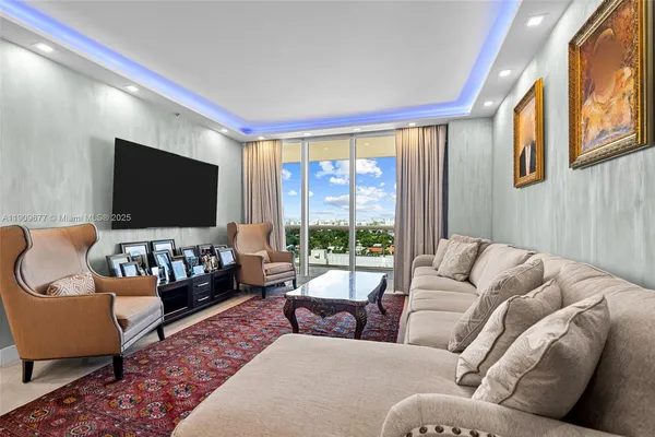 a living room with furniture and a flat screen tv