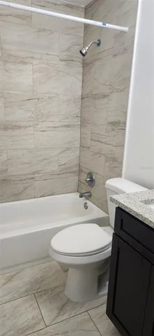a bathroom with a sink a toilet and a bathtub