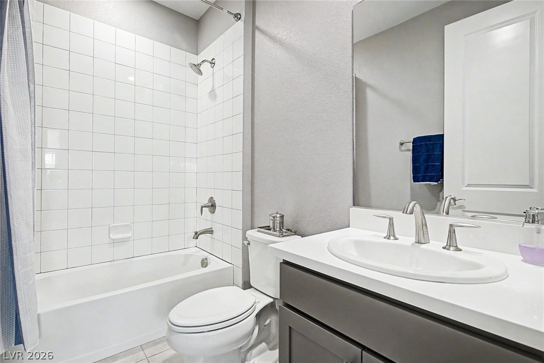 6014 Willow Ridge Court Las Vegas, NV 89135 - Photo 57 of 99 This bathroom features a sleek vanity and a classic shower-tub combination, offering everyday comfort.