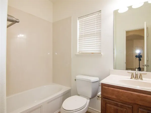 a room with a bed and a mirror