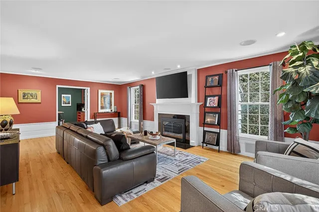 a view of a livingroom with furniture window and wooden floor