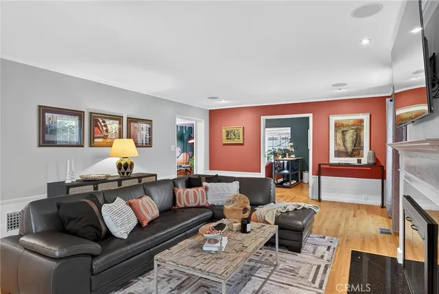 a kitchen with granite countertop a sink a counter top space and stainless steel appliances
