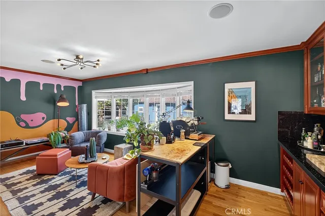 a view of a dining room with furniture wooden floor and chandelier