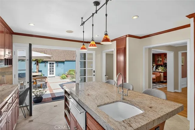 a bedroom with a large bed and a potted plant