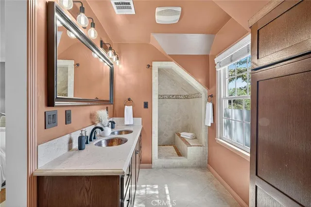 a view of a patio with table and chairs under an umbrella