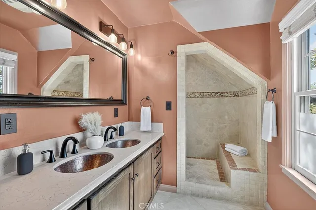 a view of a patio with couches table and chairs and potted plants