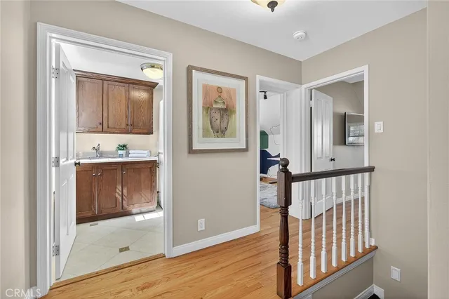 a view of a patio with couches table and chairs potted plants and palm tree