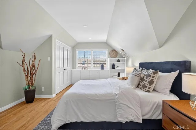 a view of a patio with table and chairs under an umbrella