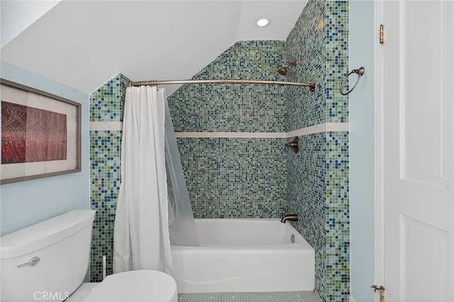 a view of a patio with table and chairs potted plants and a large tree
