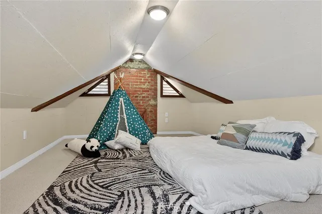 a view of a patio with a table and chairs under an umbrella
