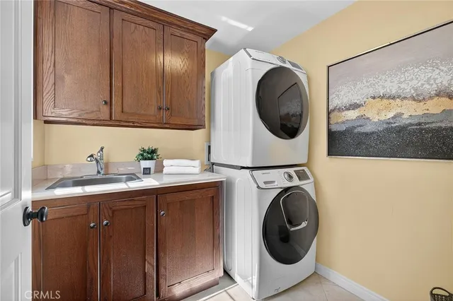 a view of a patio with a table and chairs under an umbrella