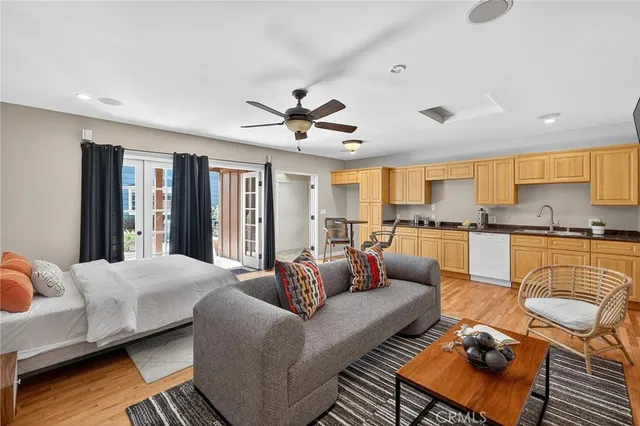 a front view of a house with a potted plant