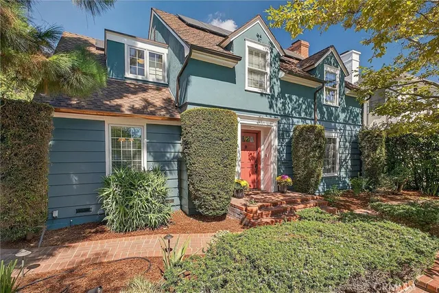 a living room with furniture fireplace and a large window