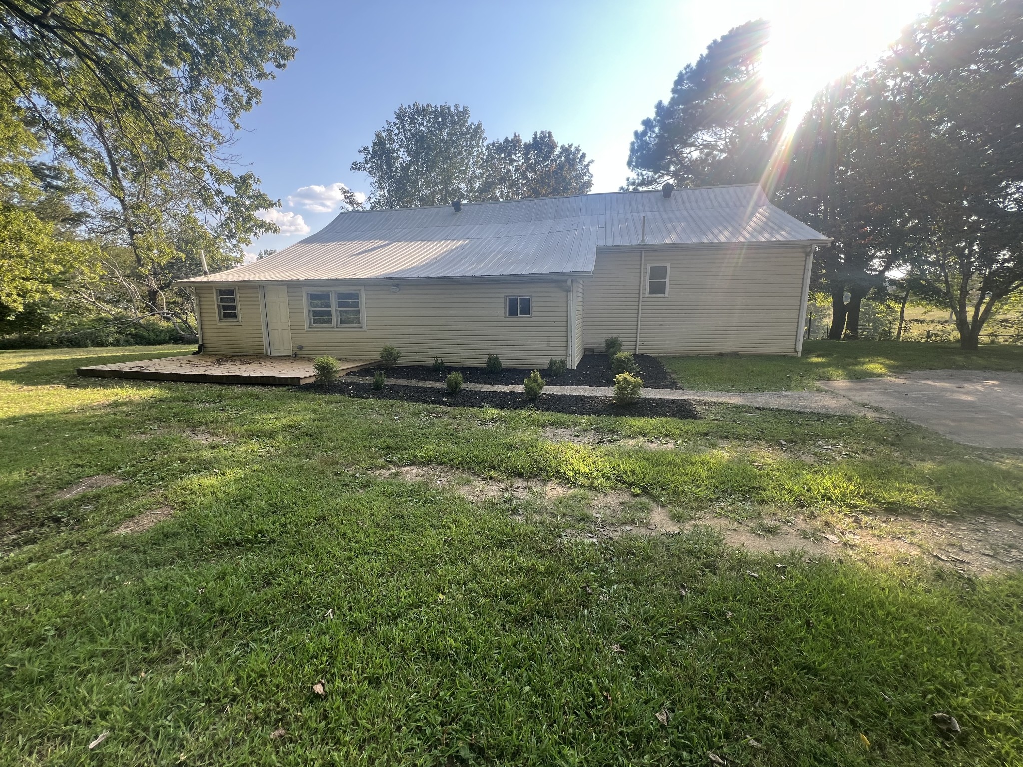 161 Woodlawn Road Pulaski, TN 38478 - Photo 2 of 46 a backyard of a house with yard and garage