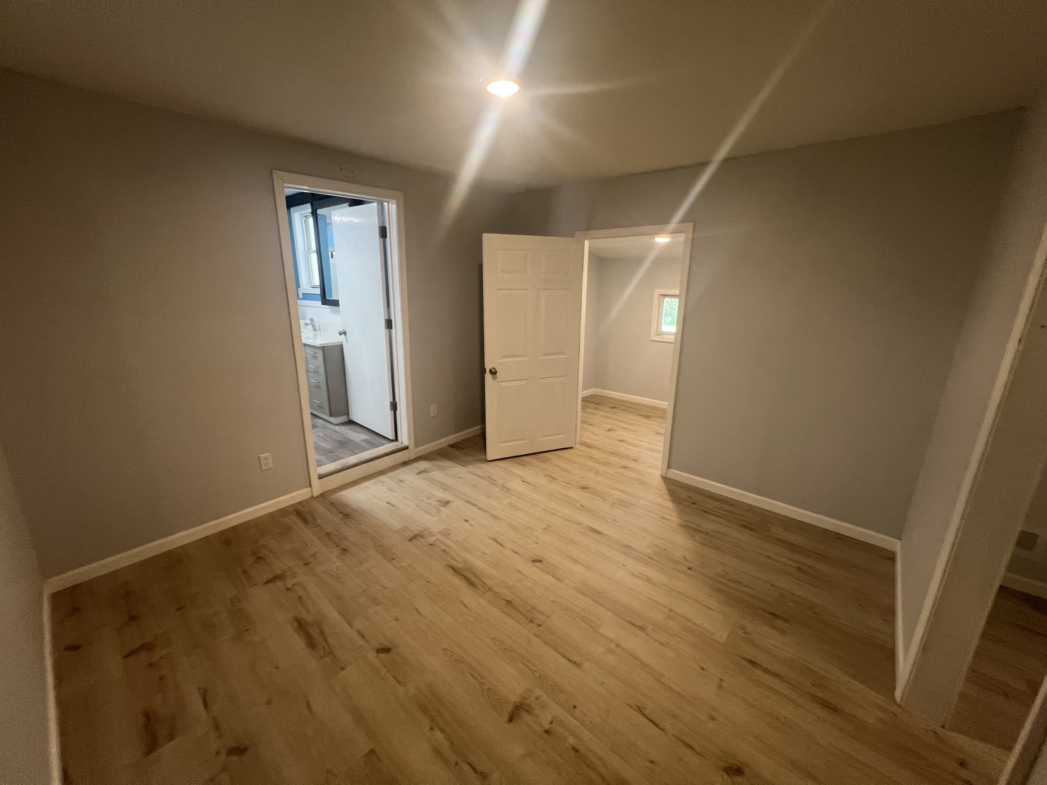 161 Woodlawn Road Pulaski, TN 38478 - Photo 23 of 46 an empty room with wooden floor and windows