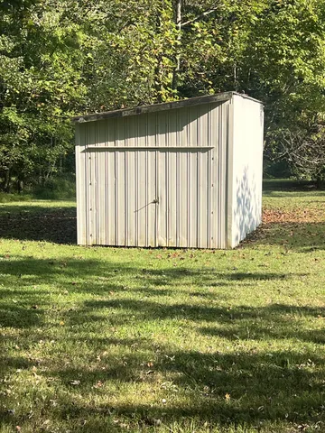 a view of a trees with a yard