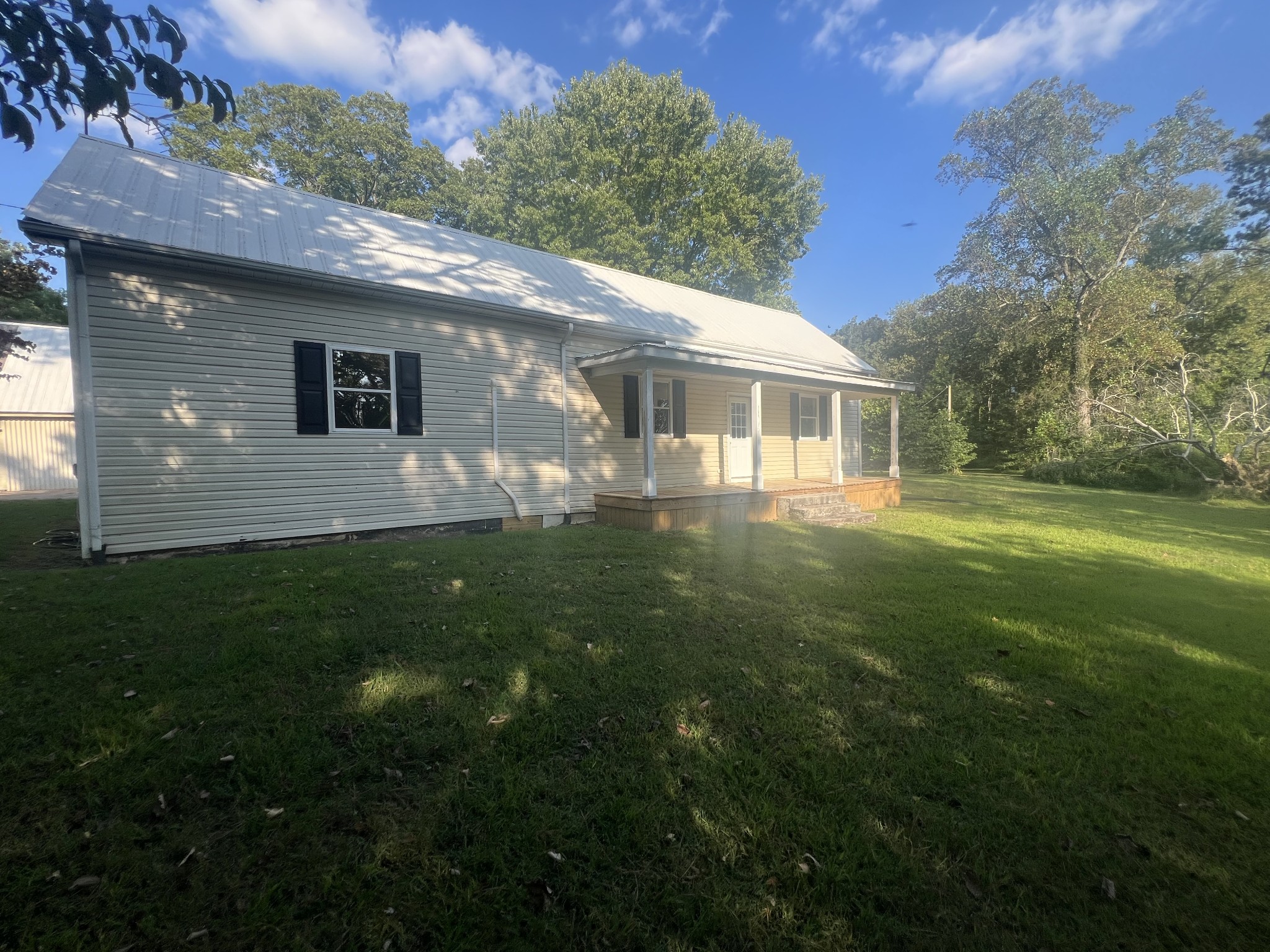 161 Woodlawn Road Pulaski, TN 38478 - Photo 40 of 46 a view of a house with a backyard