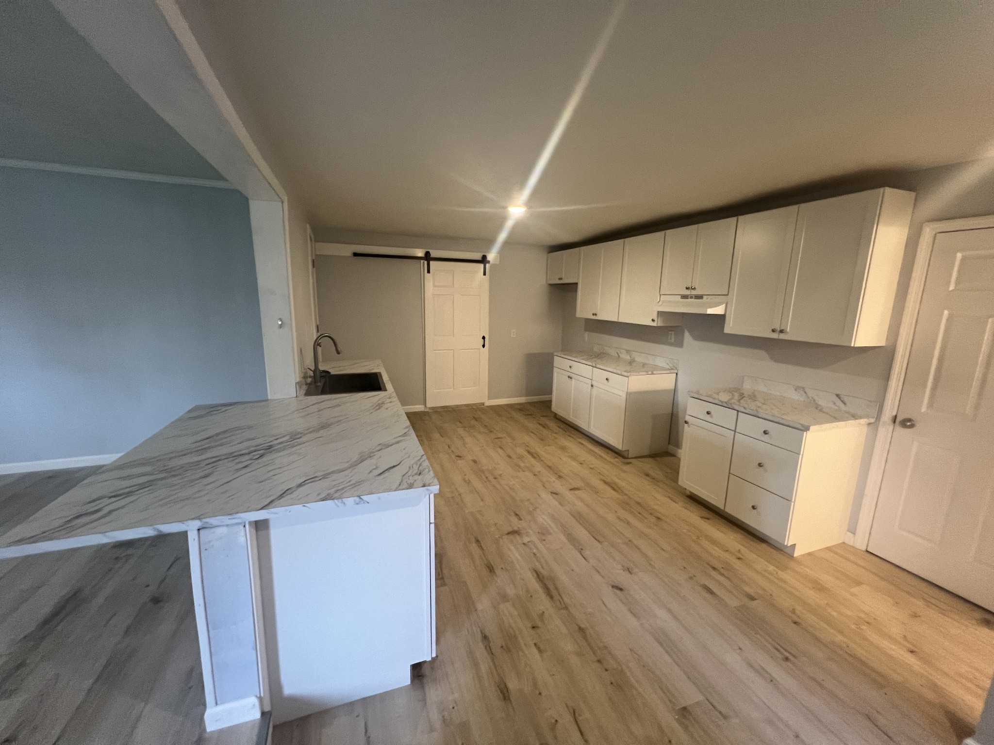 161 Woodlawn Road Pulaski, TN 38478 - Photo 8 of 46 a kitchen with stainless steel appliances granite countertop a wooden cabinets and a wooden floor