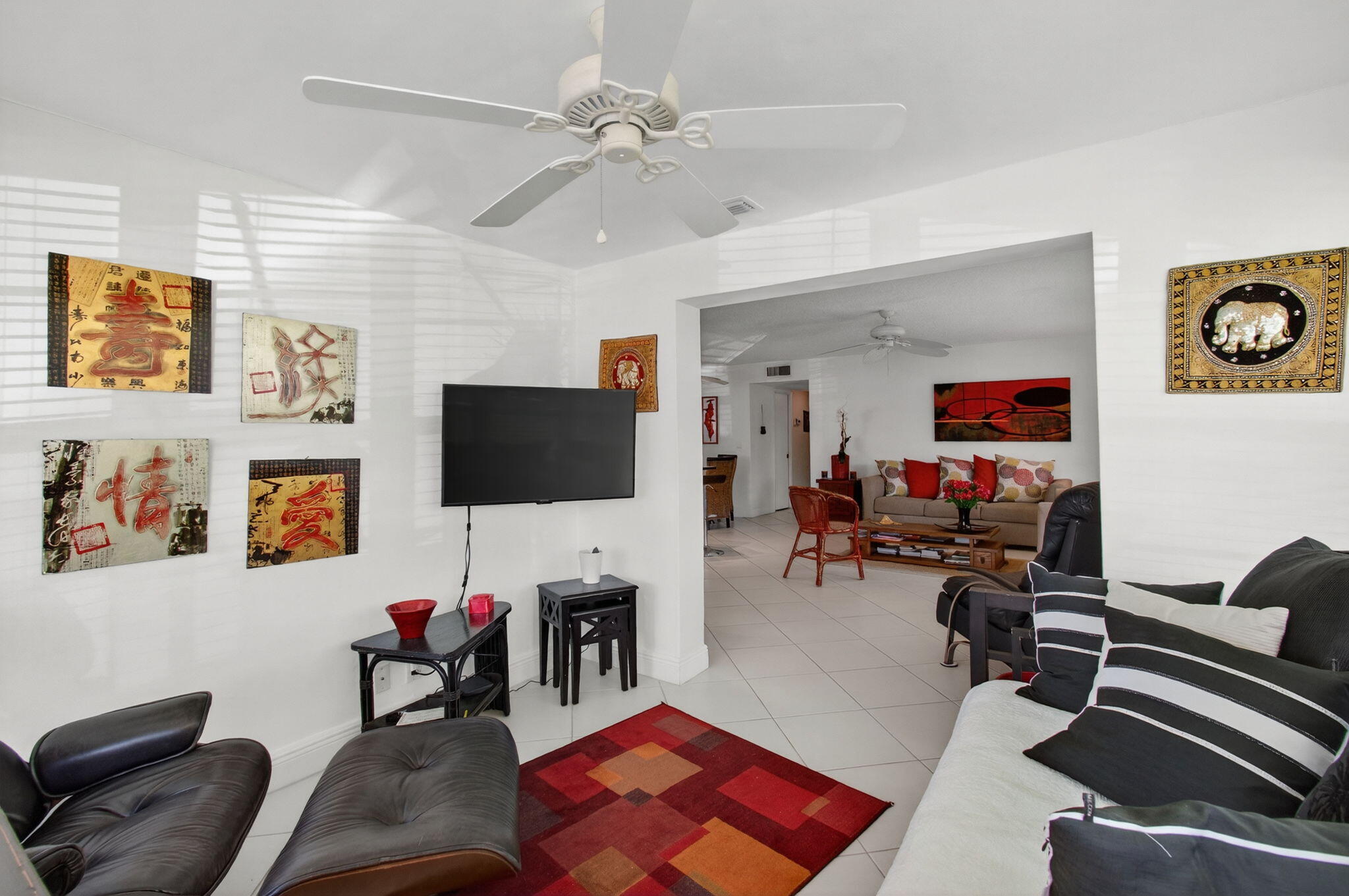1305 High Point Way Southeast, Unit D Delray Beach, FL 33445 - Photo 14 of 53 a living room with furniture and a flat screen tv