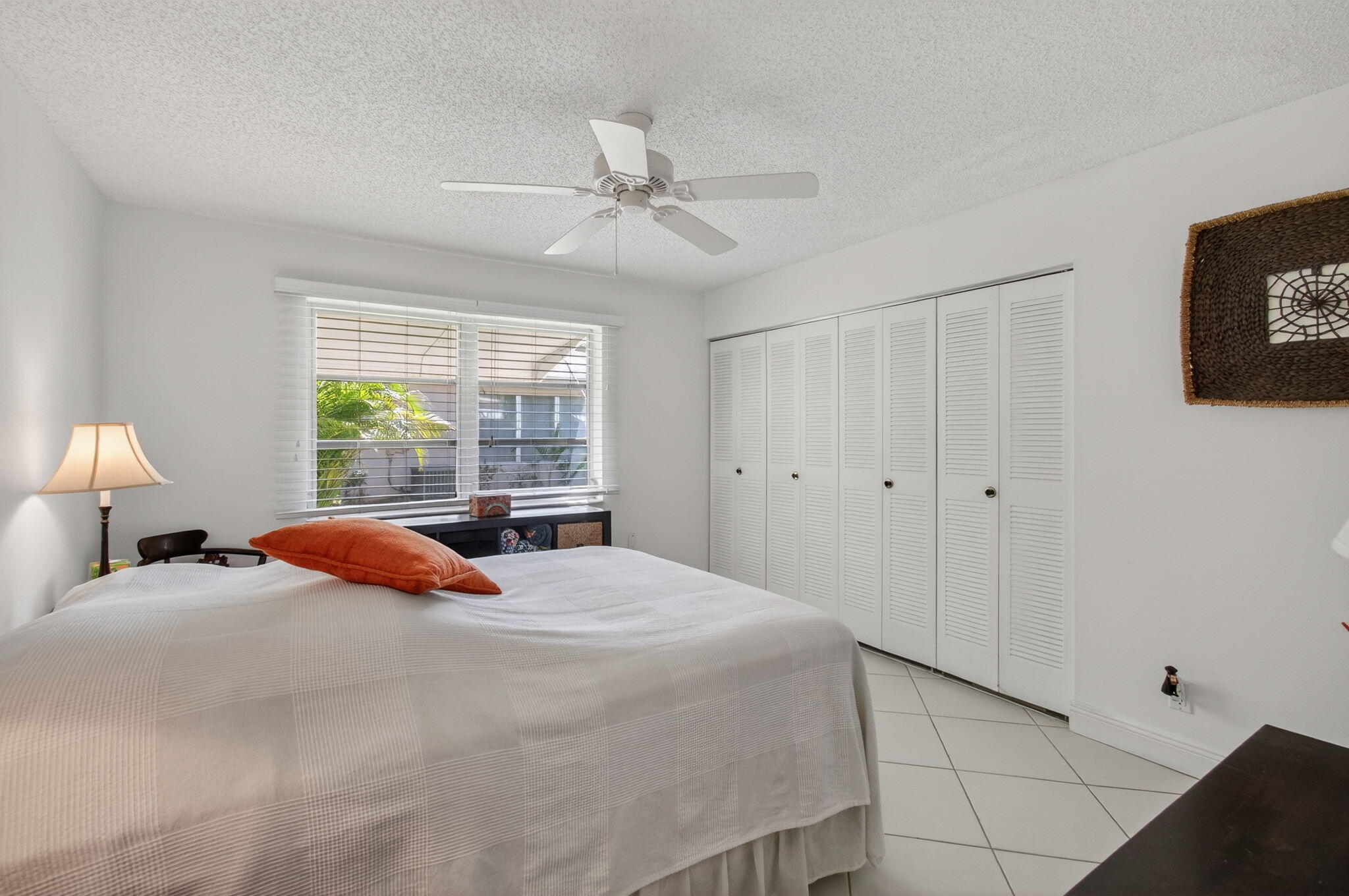 1305 High Point Way Southeast, Unit D Delray Beach, FL 33445 - Photo 24 of 53 a bedroom with a bed and a window