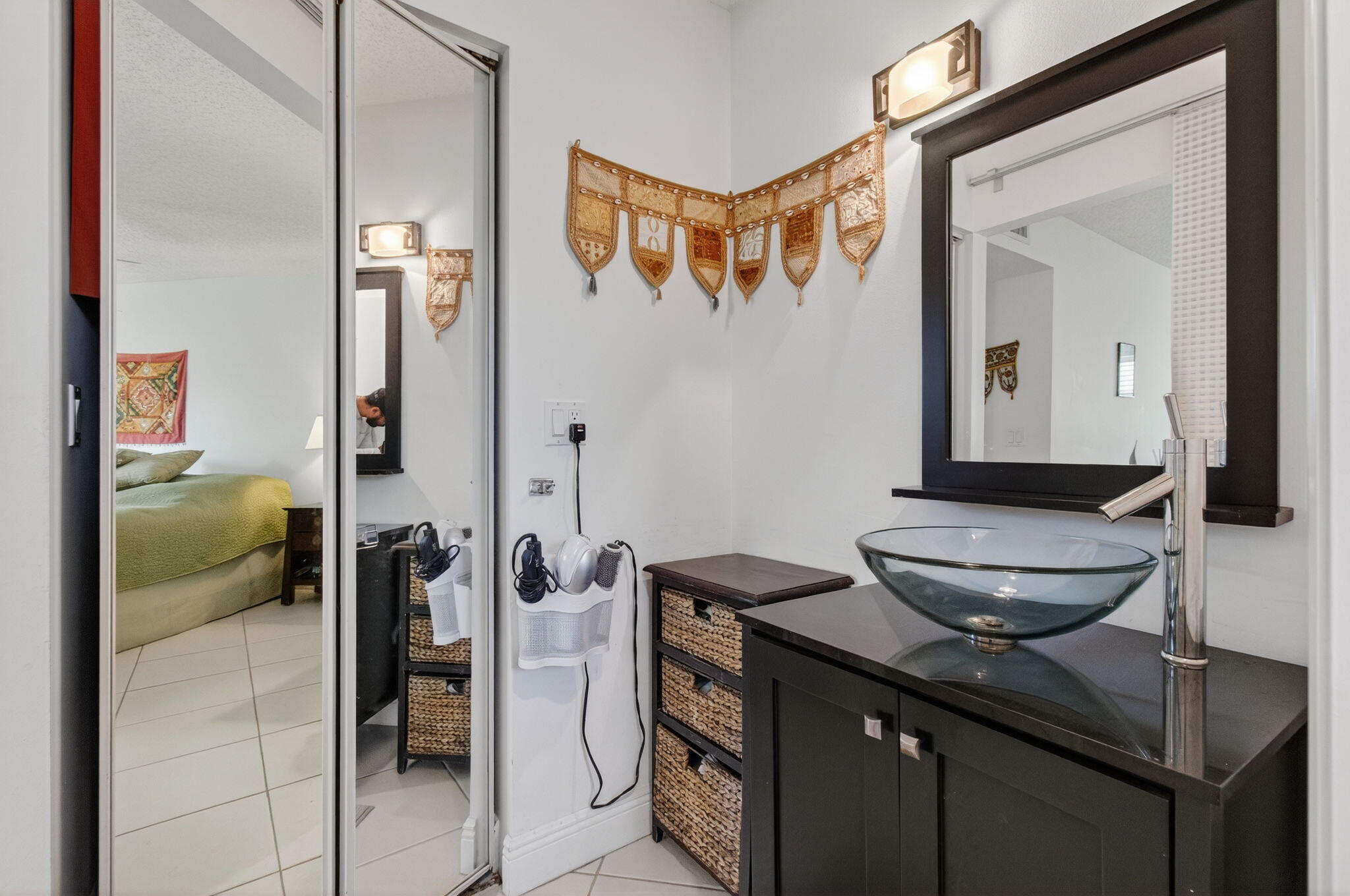 1305 High Point Way Southeast, Unit D Delray Beach, FL 33445 - Photo 25 of 53 a bathroom with a toilet a sink and mirror