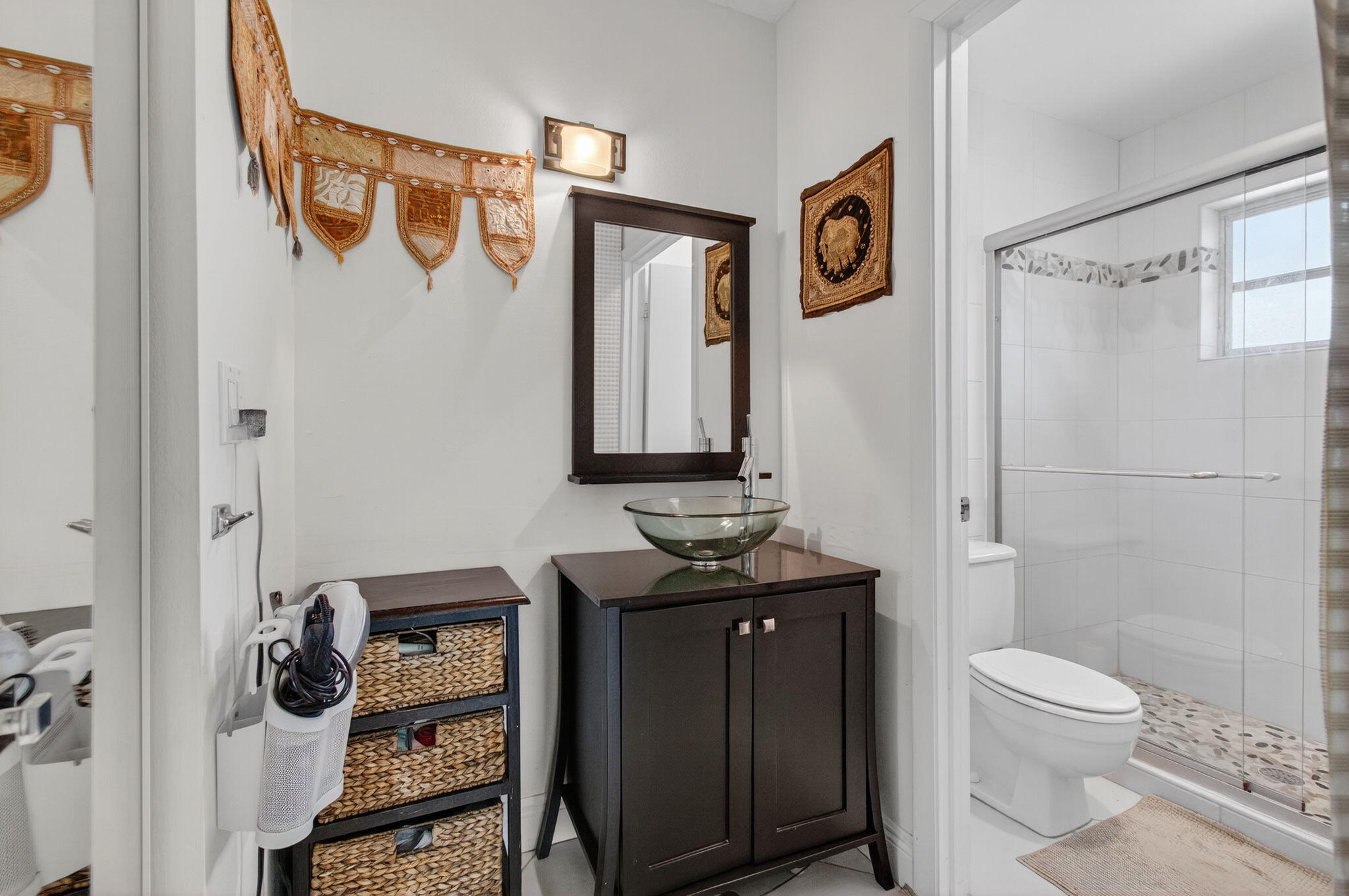 1305 High Point Way Southeast, Unit D Delray Beach, FL 33445 - Photo 26 of 53 a bathroom with a toilet a sink and shower
