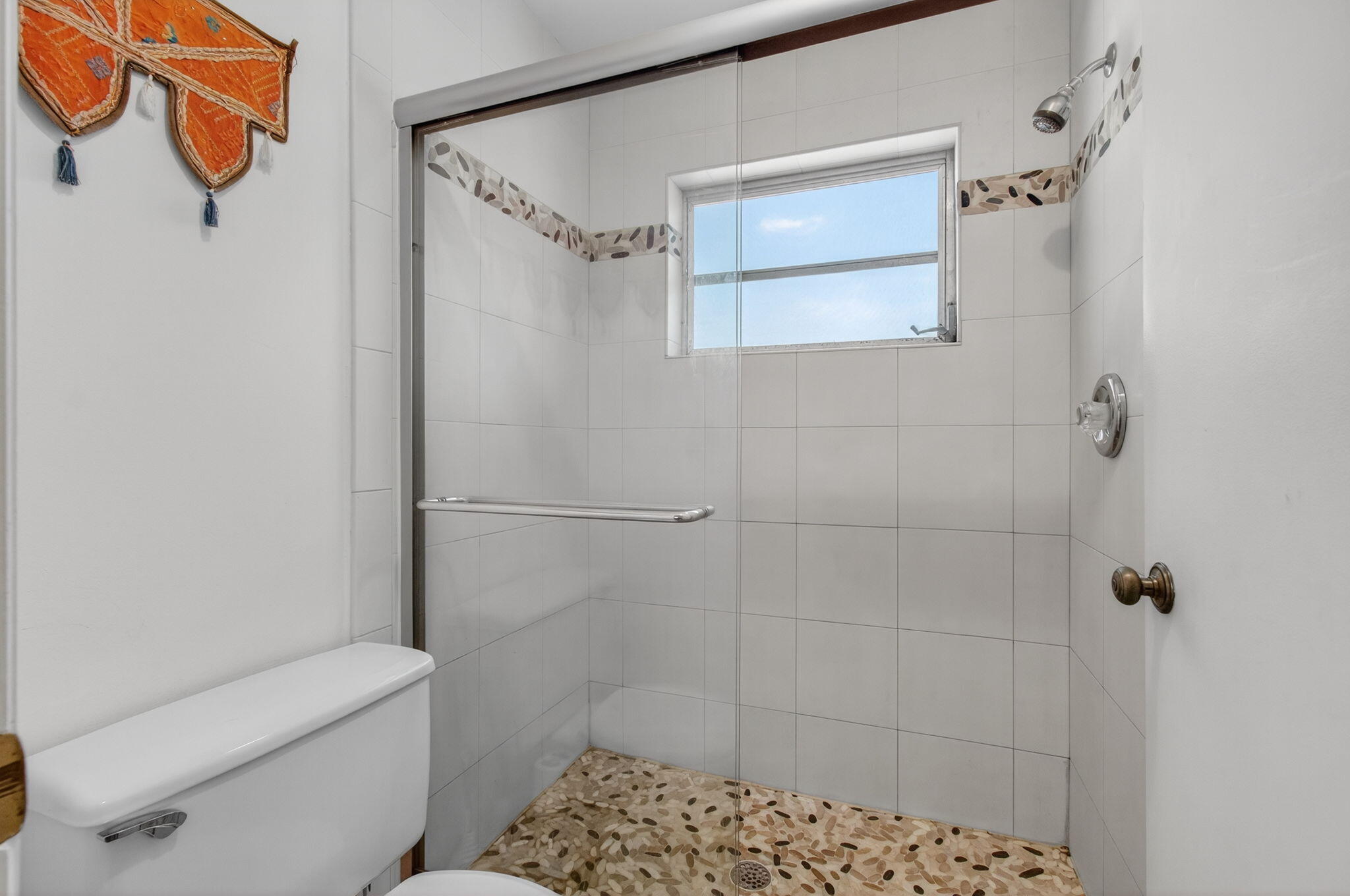 1305 High Point Way Southeast, Unit D Delray Beach, FL 33445 - Photo 27 of 53 a bathroom with a shower toilet and sink