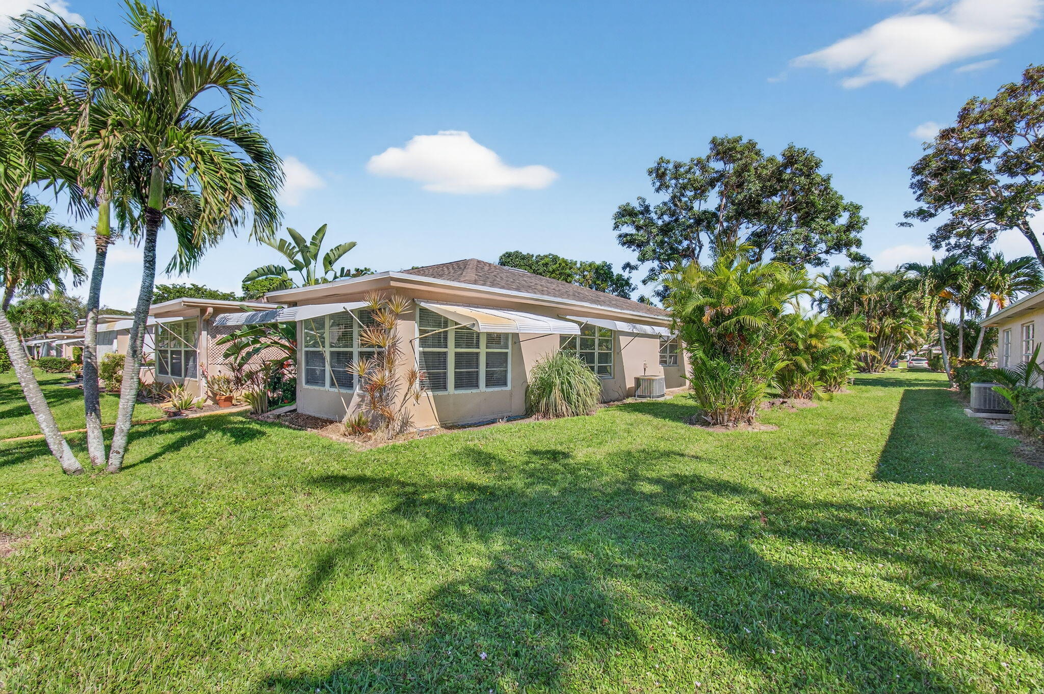 1305 High Point Way Southeast, Unit D Delray Beach, FL 33445 - Photo 3 of 53 a view of a house with a yard