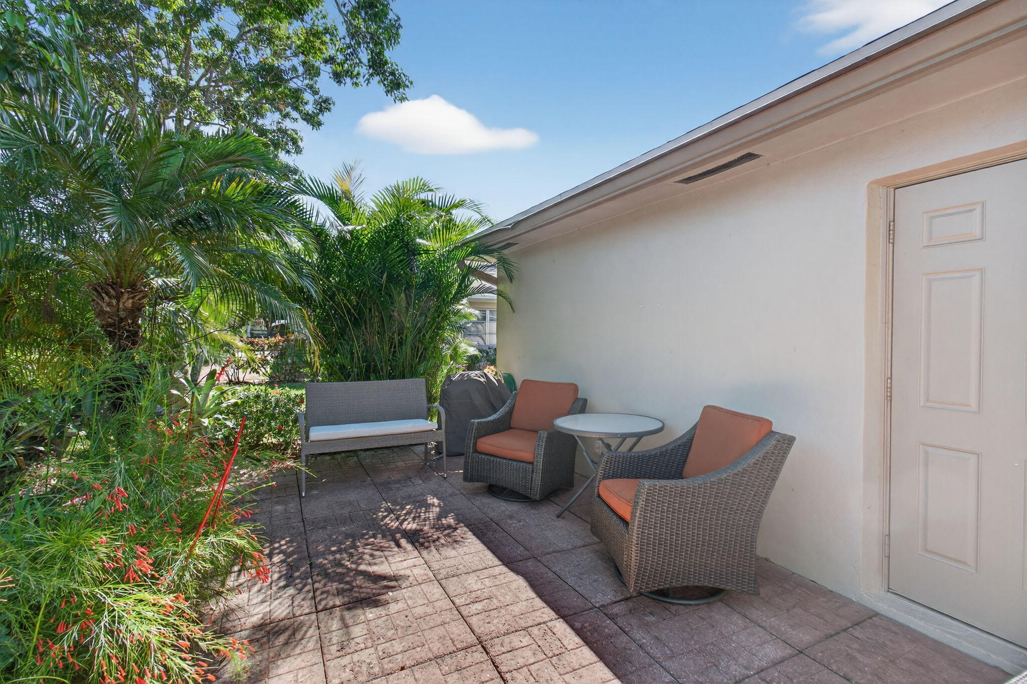 1305 High Point Way Southeast, Unit D Delray Beach, FL 33445 - Photo 36 of 53 a outdoor living space with furniture and a potted plant