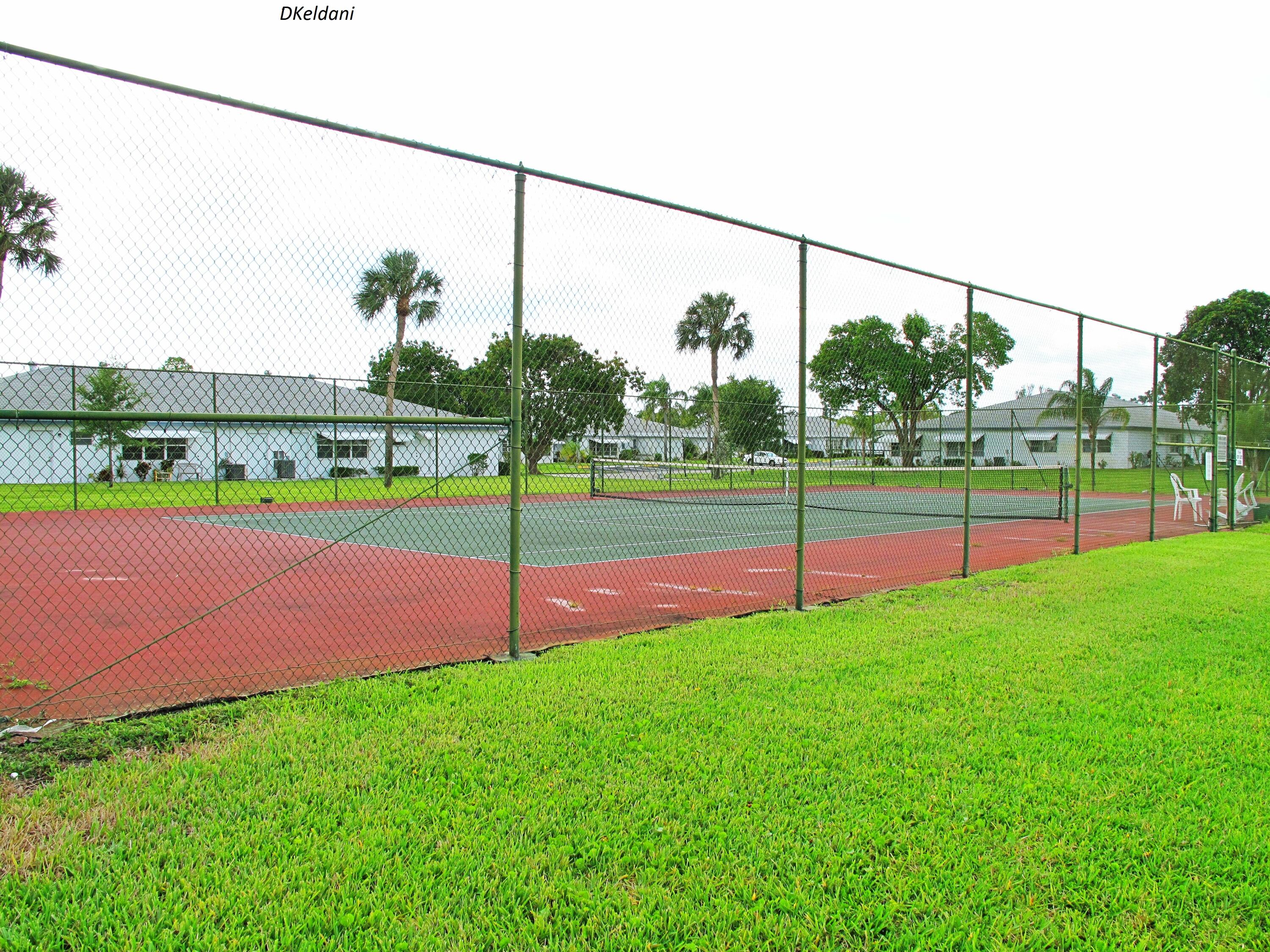1305 High Point Way Southeast, Unit D Delray Beach, FL 33445 - Photo 48 of 53 a view of a park with a big yard
