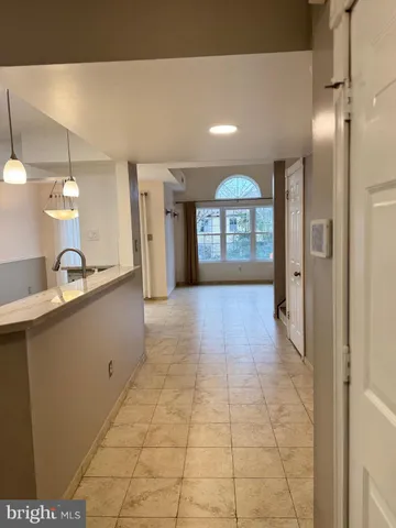 a view of a kitchen with a sink and a window
