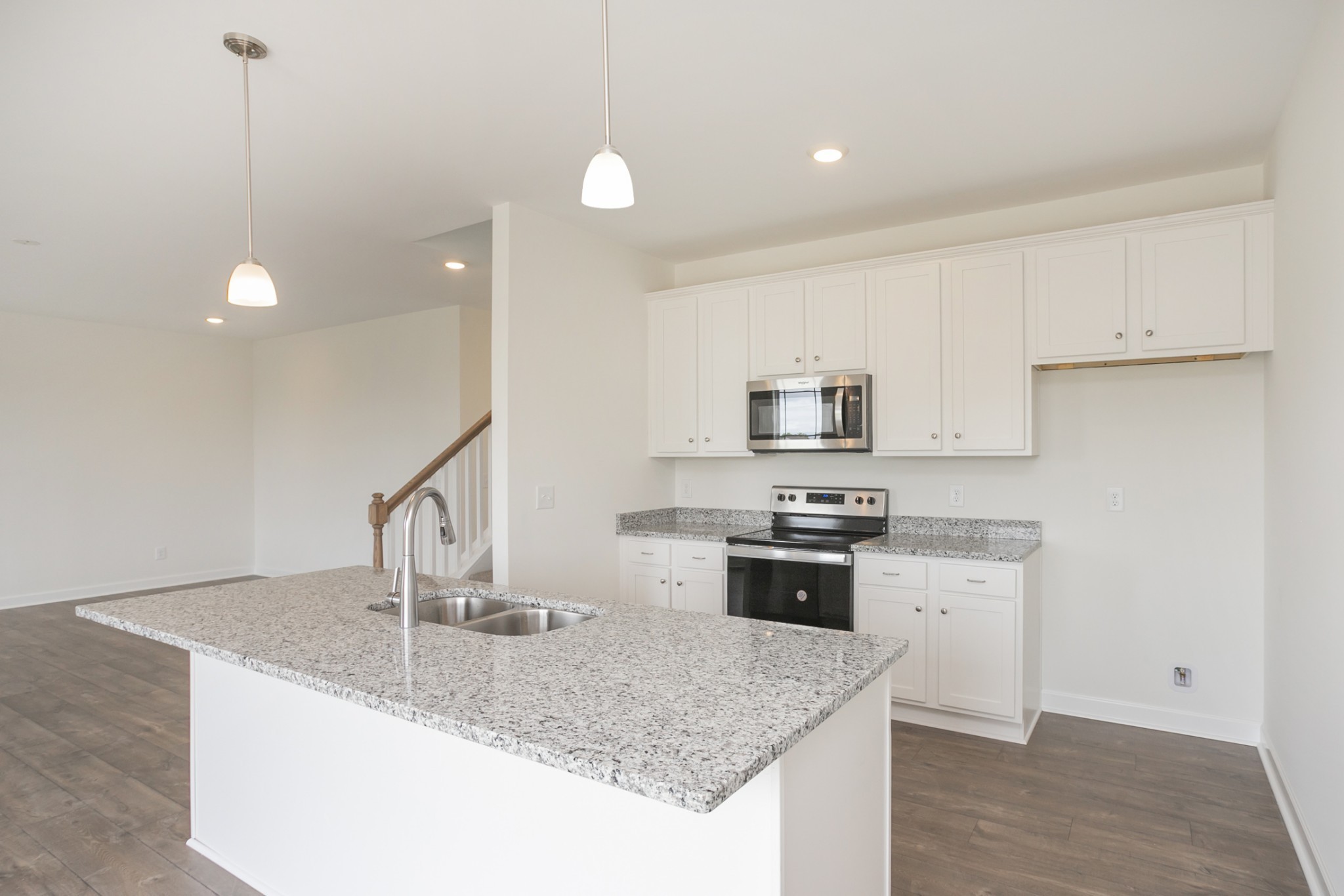 6008 Cavalry Ct Spring Hill Spring Hill, TN 37174 - Photo 15 of 42 a kitchen with stainless steel appliances granite countertop a sink a stove and a refrigerator