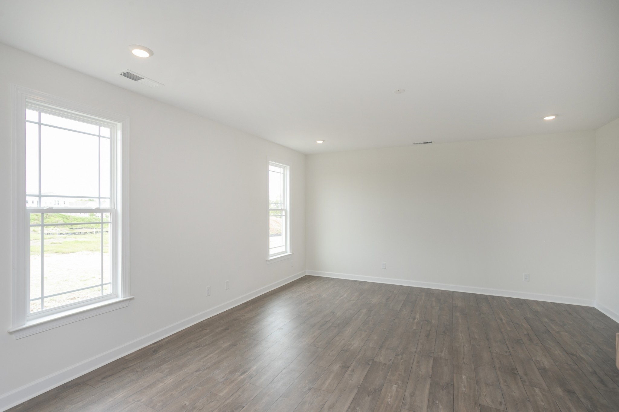 6008 Cavalry Ct Spring Hill Spring Hill, TN 37174 - Photo 21 of 42 an empty room with wooden floor and windows