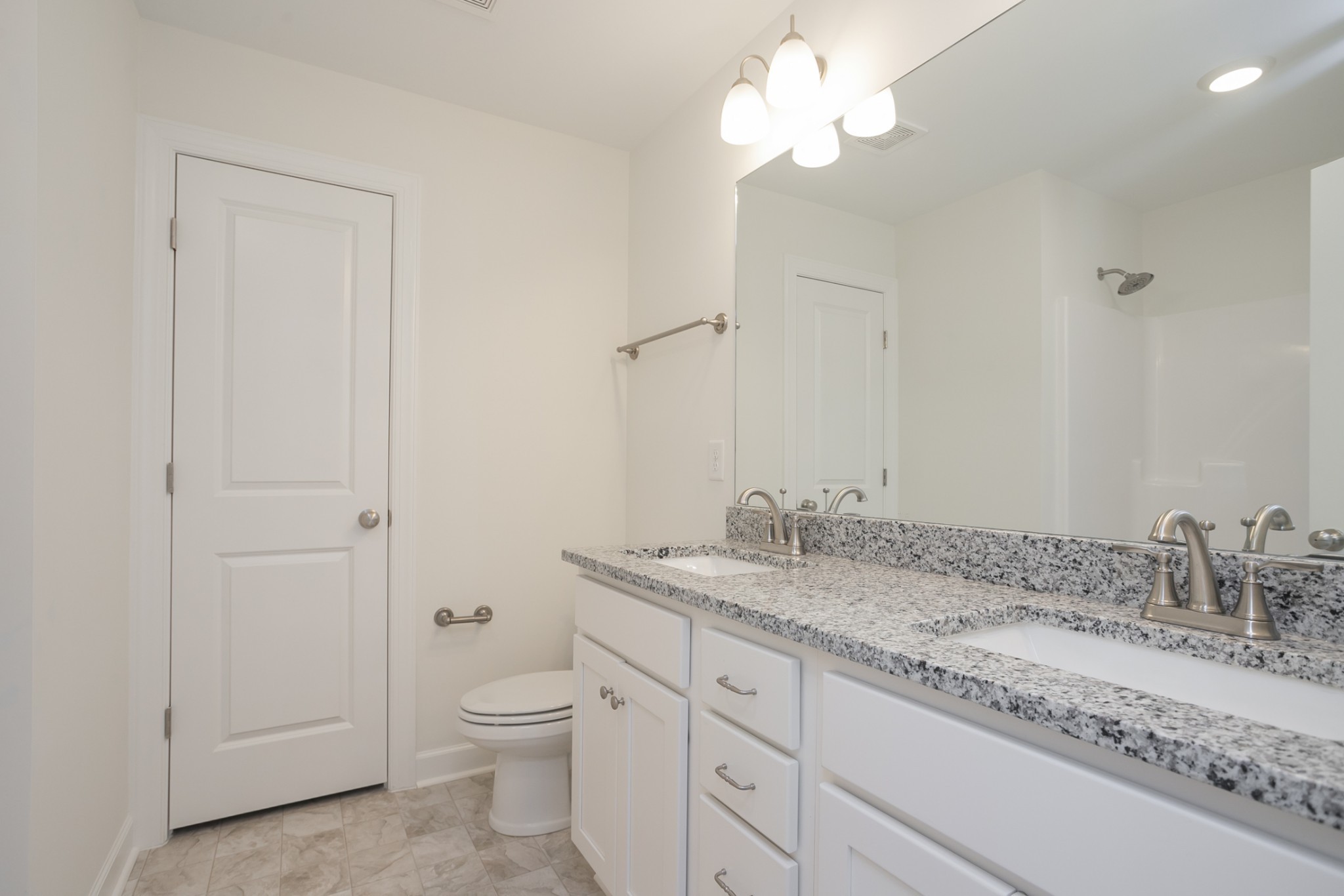 6008 Cavalry Ct Spring Hill Spring Hill, TN 37174 - Photo 34 of 42 a bathroom with a granite countertop sink a toilet and a mirror