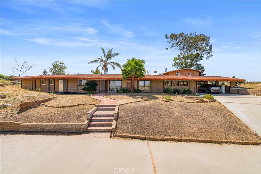 6308 Hawarden Drive Riverside, CA 92506 - Photo 6 of 37 a front view of a house with a yard