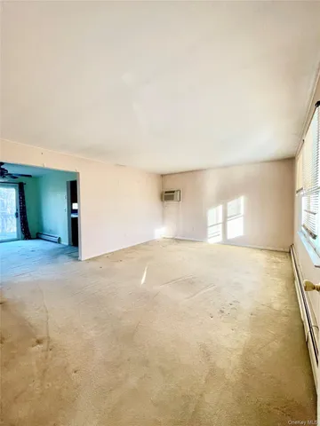 a view of empty room with windows