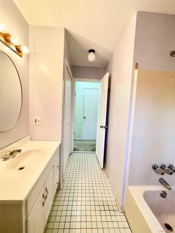 an empty room with windows and painted walls