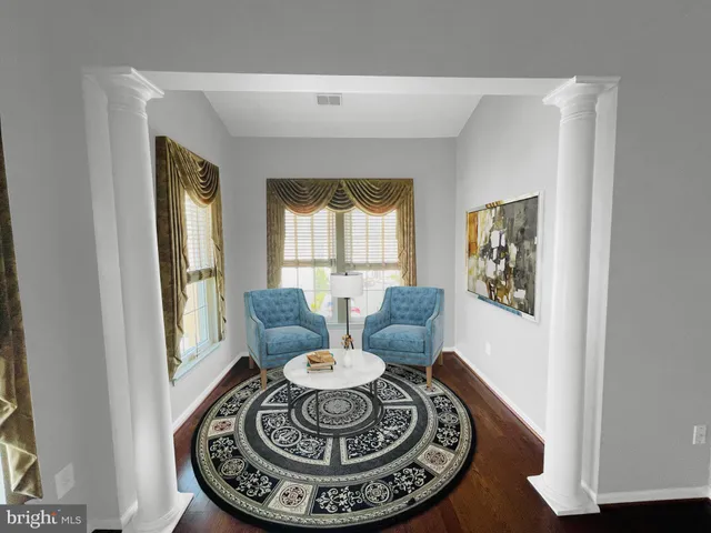 a view of a livingroom with furniture and a potted plant