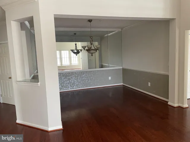 wooden floor in a hall with a window