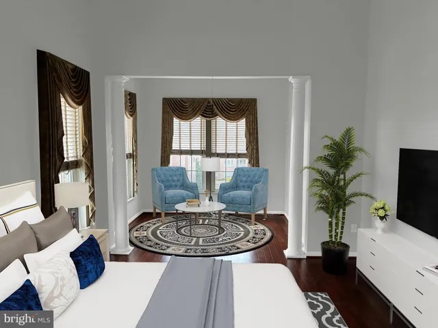 a bedroom with a bed a large window and a flat screen television