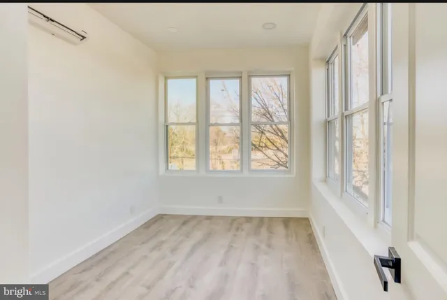 a view of a room with a large window