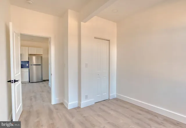 an empty room with closet area