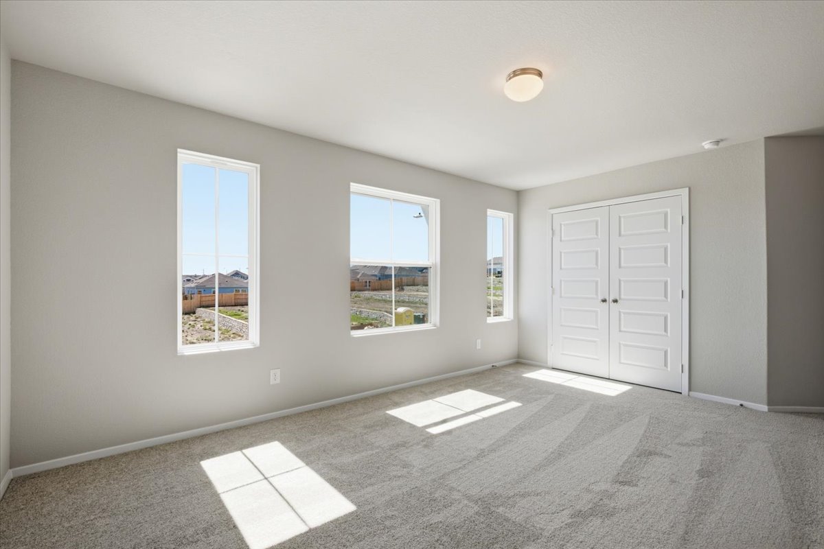 2714 Foss Road Manor, TX 78653 - Photo 24 of 34 Natural light pours through multiple windows across this comfortable, carpeted space.